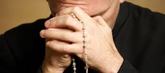 priest in prayer